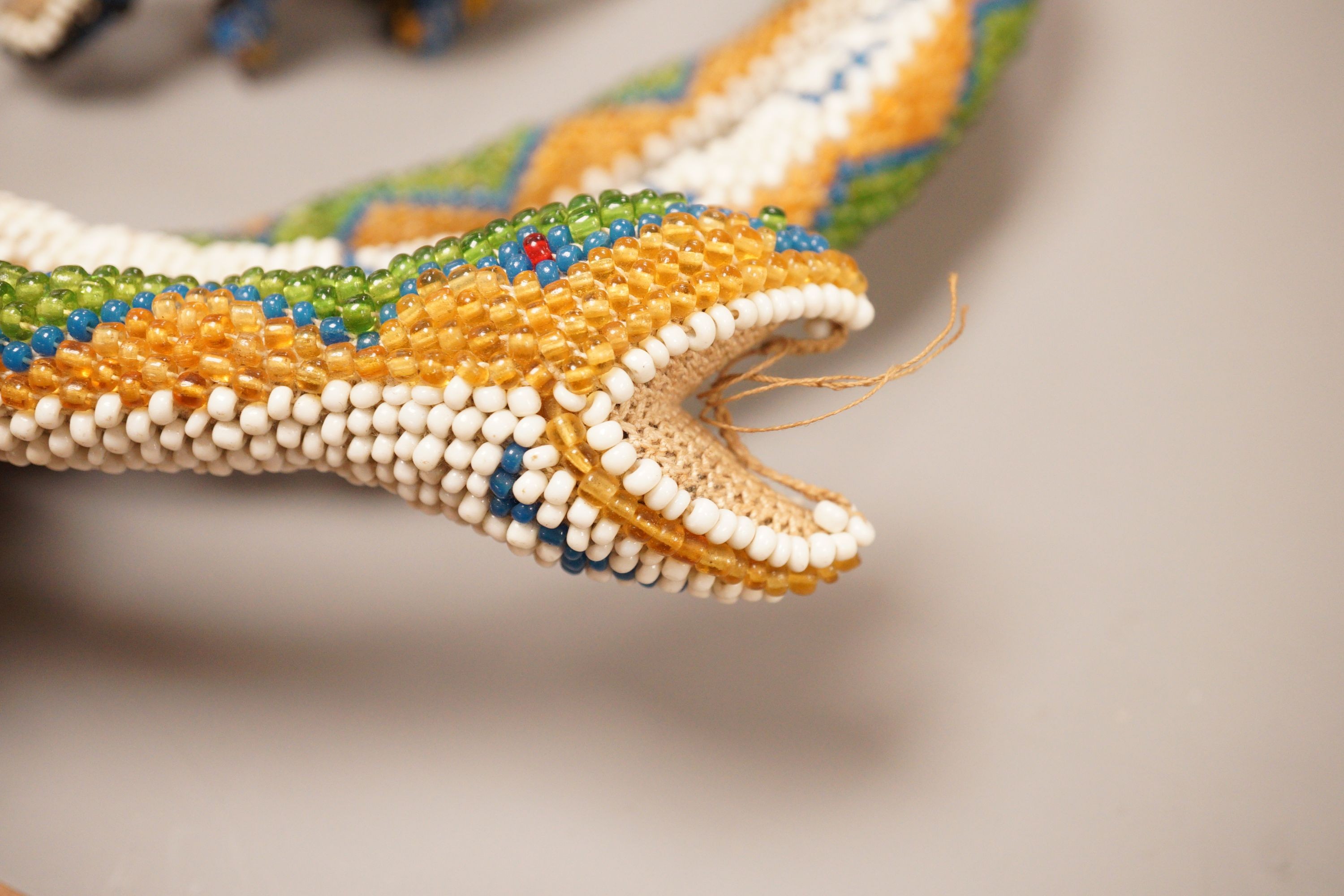 A Turkish Prisoner beadwork model of a snake, and another model